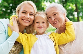 Mother daughter and granddaughter smiling together