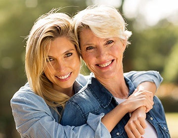 Smiling mother and daughter