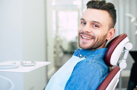 Smiling patient at appointment for root canal therapy