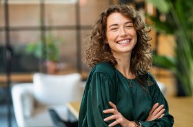 Smiling woman enjoying the benefits of root canal treatment