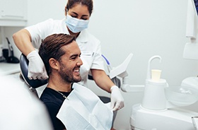 Happy dental patient preparing to undergo treatment