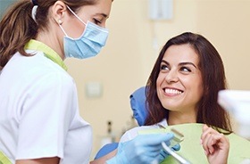 Woman in dental chair smiling