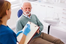 Dentist and patient discussing treatment plan