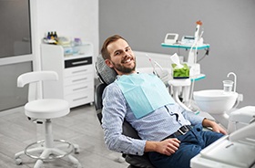 Man reclining in chair during visit to emergency dentist in Hamden