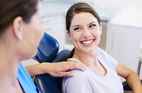 Woman in dental chair smiling