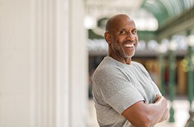 Man with dental implants in Hamden smiling confidently