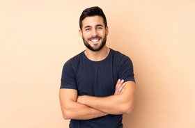 Portrait of man enjoying benefits of implant-supported single tooth replacement