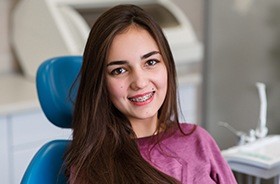 Woman with braces in dental chair