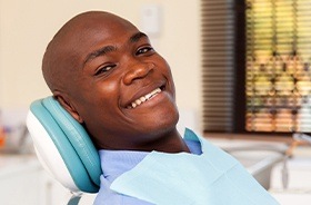 Smiling man in dental chair