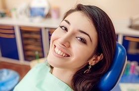 Smiling woman in dental chair