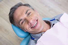 Smiling man in dental chair