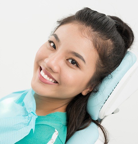 Smiling woman in dental chair