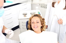 relaxed patient awaiting treatment by dentist and hygienist