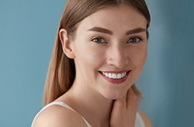 Portrait of beautiful young woman smiling with veneers in Hamden