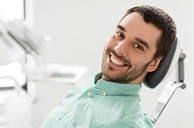 Smiling man in dental chair