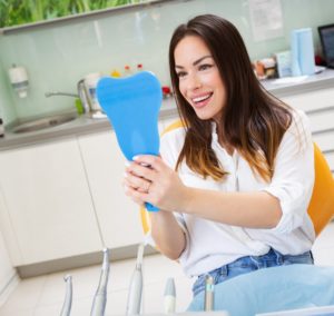 Patient visiting dentist as part of maintaining her veneers