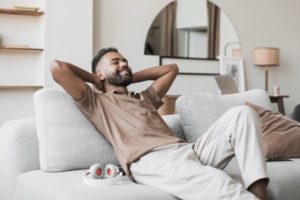 Man smiling while resting at home