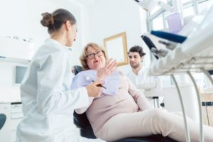 Dentist and patient having a friendly conversation