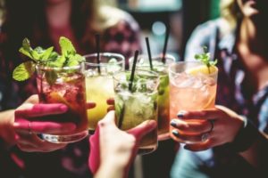 Group of friends drinking cocktails together