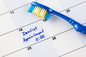 Dental appointment marked on calendar in blue ink 